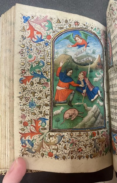 Color miniature in a 15th-century book of hours depicting an angel appearing to shepherds