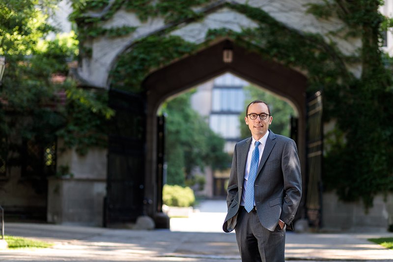 Torsten Reimer stands in front of Hull Gate and Regenstein Library